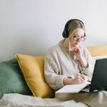 photo of woman taking notes
